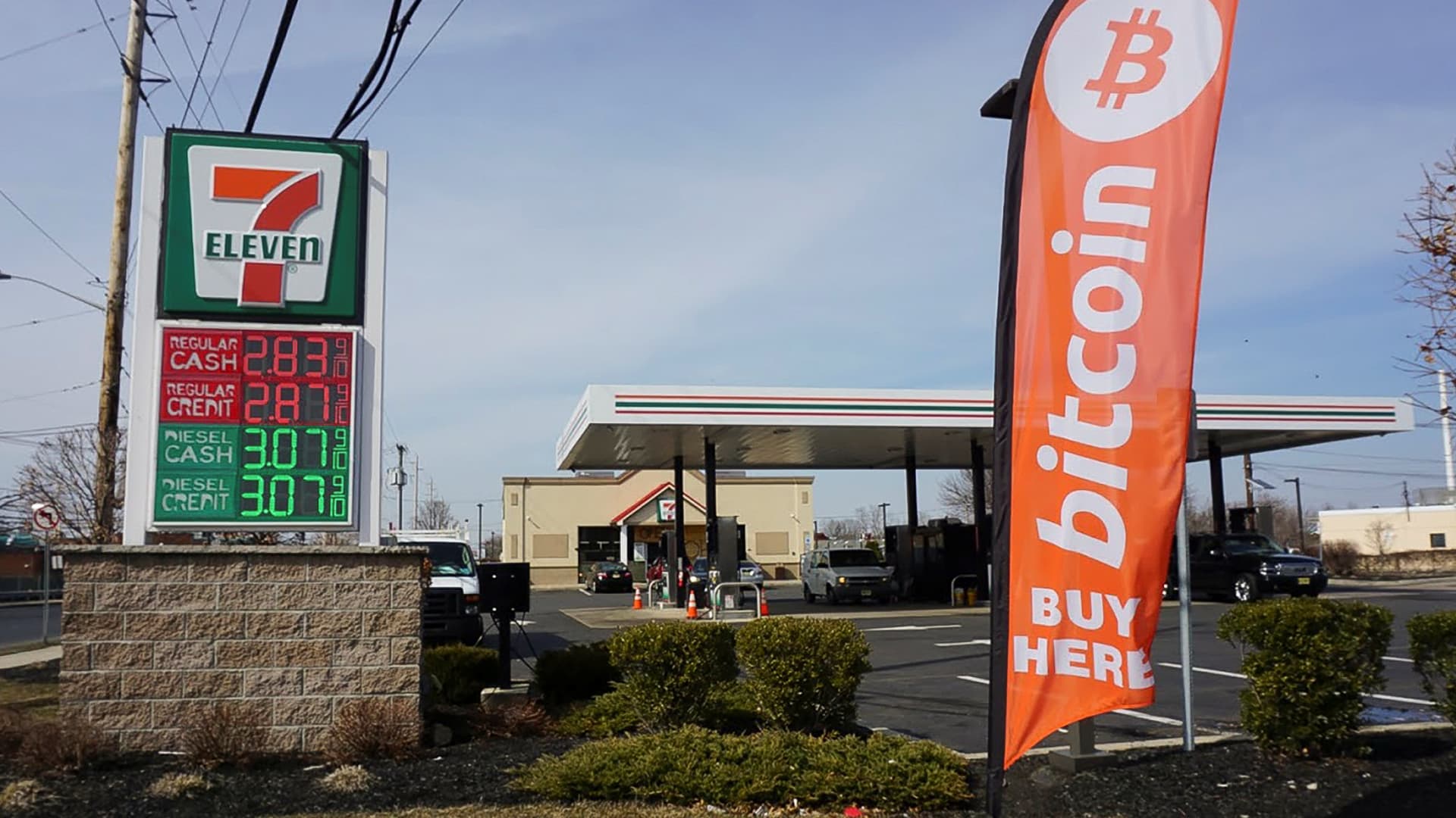 A flag at a 7-Eleven gas station in Lawrenceville, New Jersey, advertises a Cash2Bitcoin ATM in March of 2021.