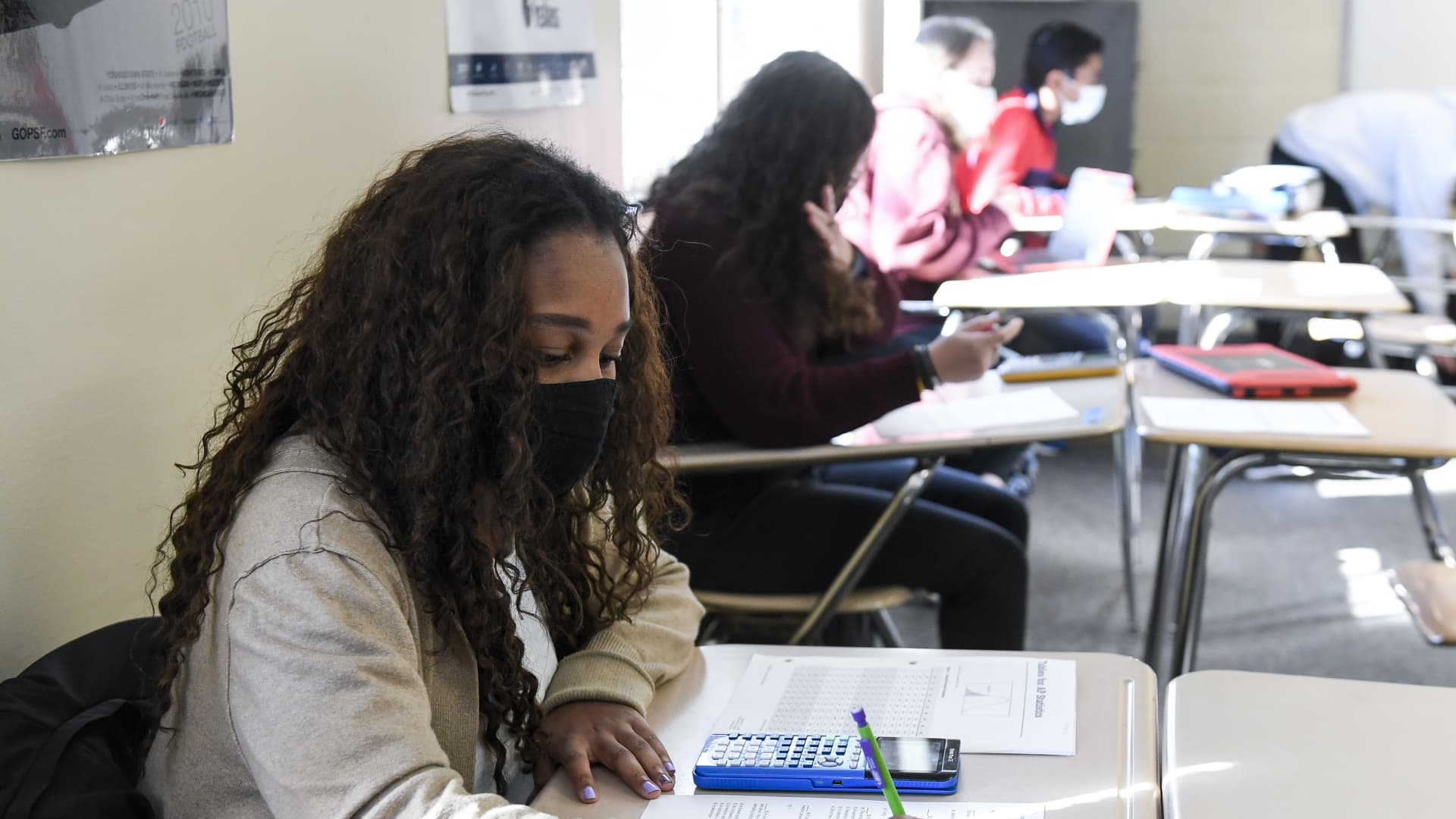 Giani Clarke,18, a senior at Wilson High School, takes a test in her AP Statistics class. The desks are doubled as a way to provide more social distancing.