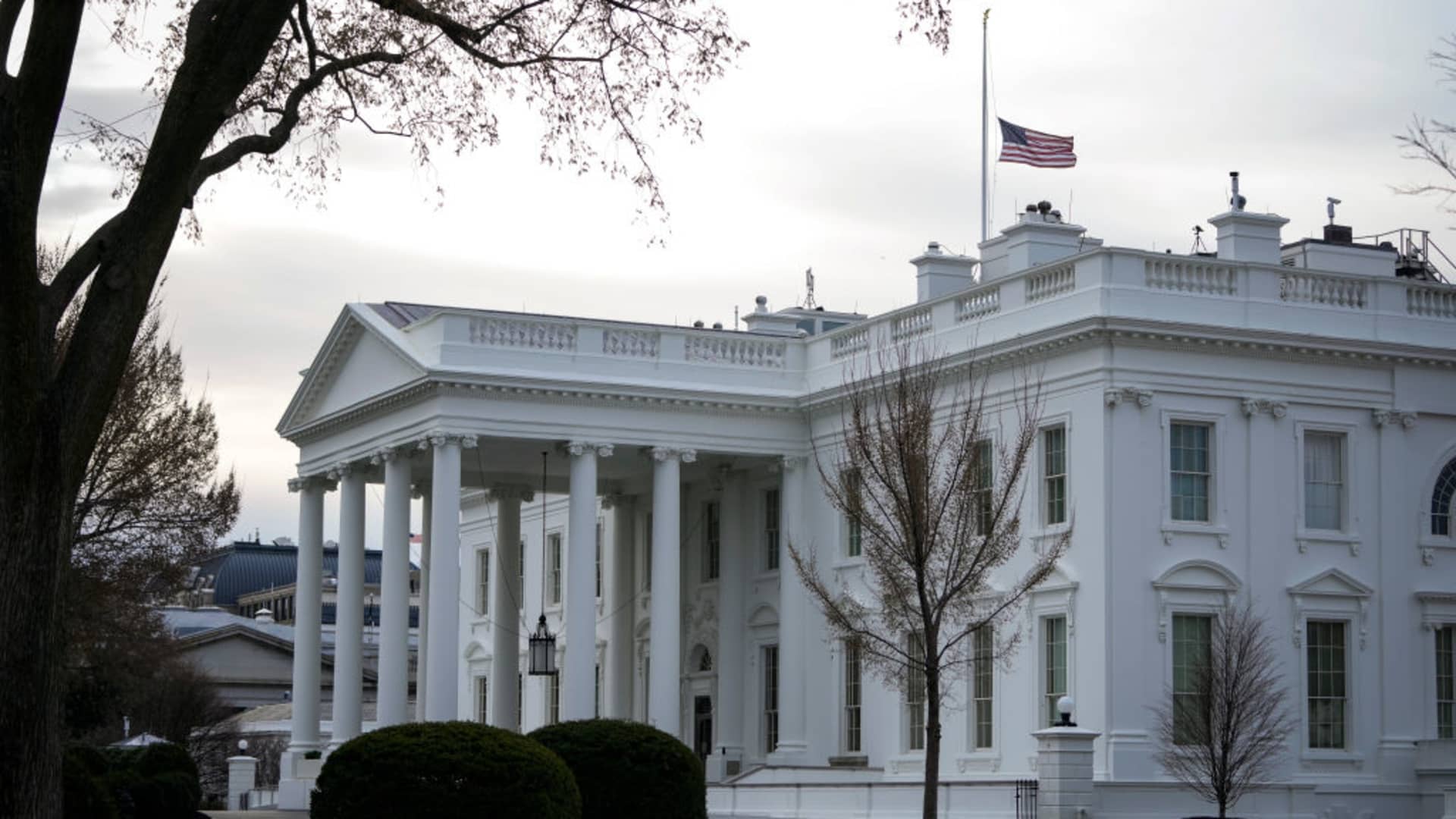 The American flag flies at half-staff at the White House in Washington, DC.