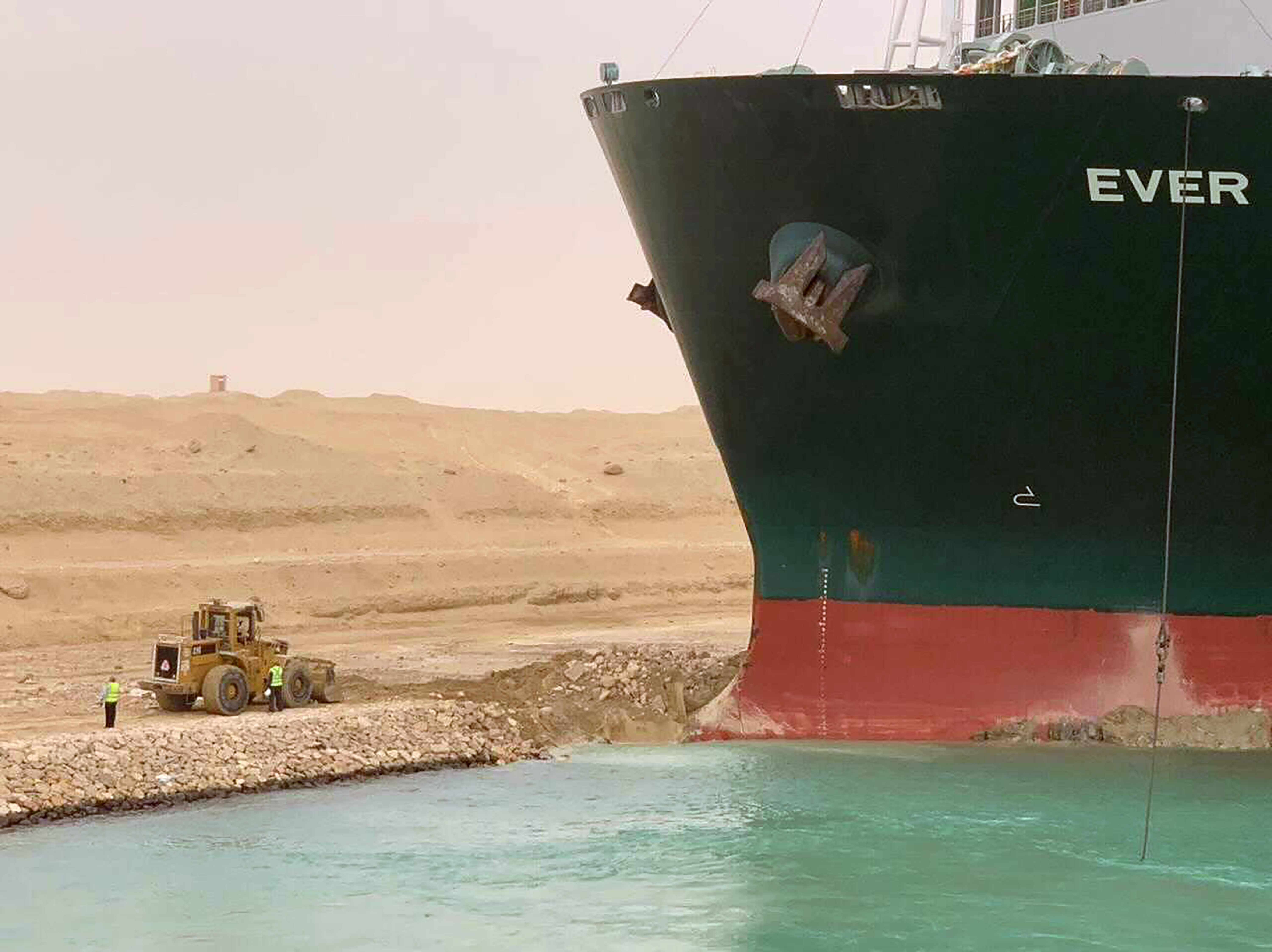 The photos show the container ship stranded in the Suez Canal