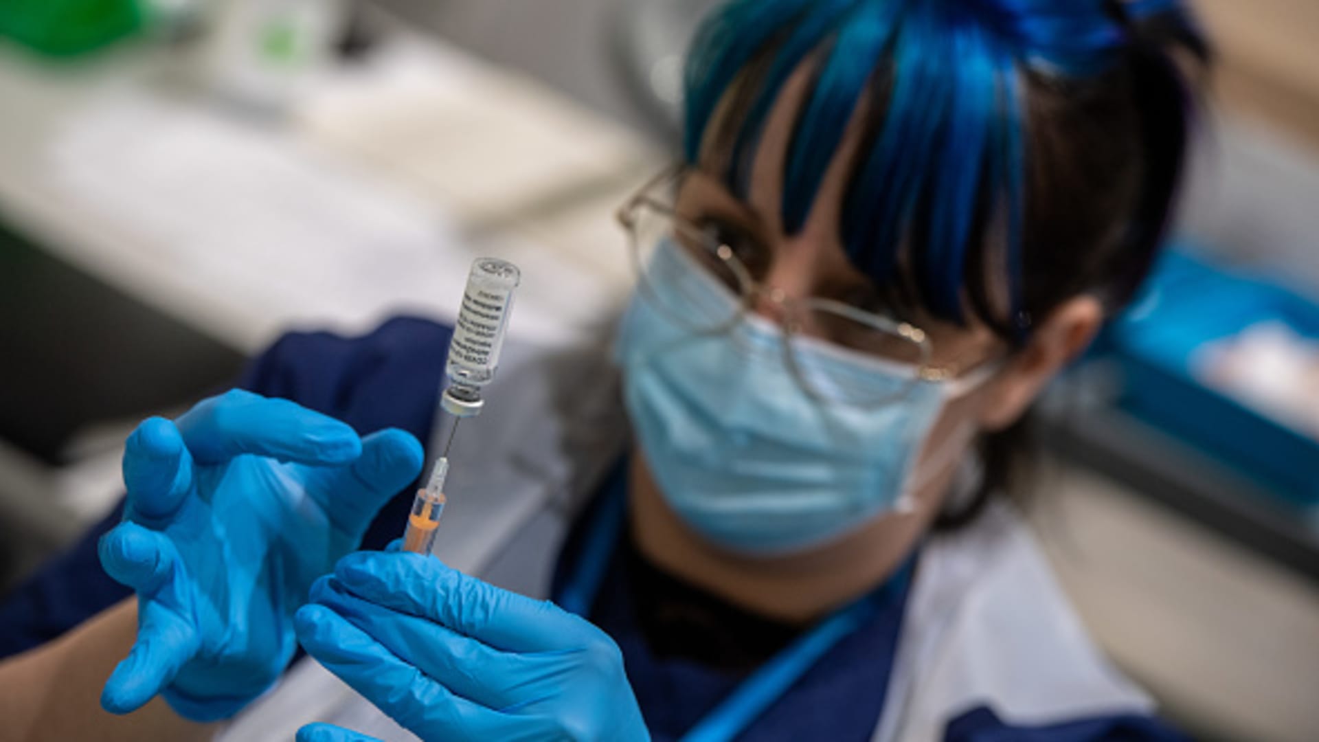 Covid vaccinator, Petra Moinar, prepares syringes with the AstraZeneca vaccine before it is administered at Battersea Arts Centre on March 8, 2021 in London, England.