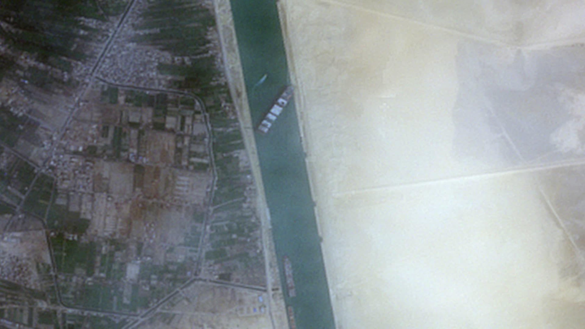 Satellite images of container ship Ever Given stuck in Egypt's Suez Canal.