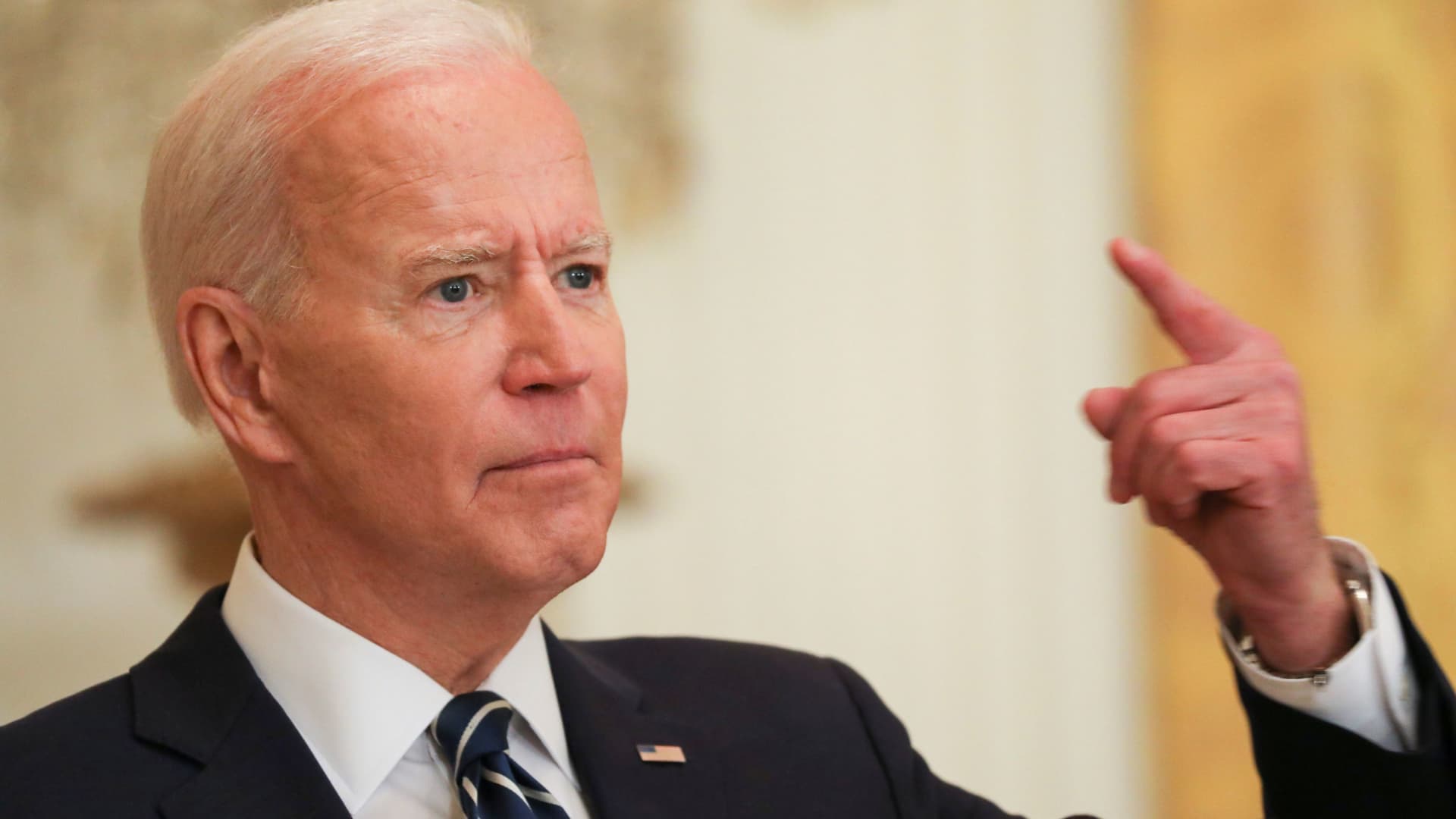 President Joe Biden gestures as he answers a question during his first formal news conference as president in the East Room of the White House in Washington, March 25, 2021.