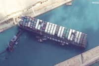 Satellite imagery shows work underway to free ship Ever Given in the Suez Canal