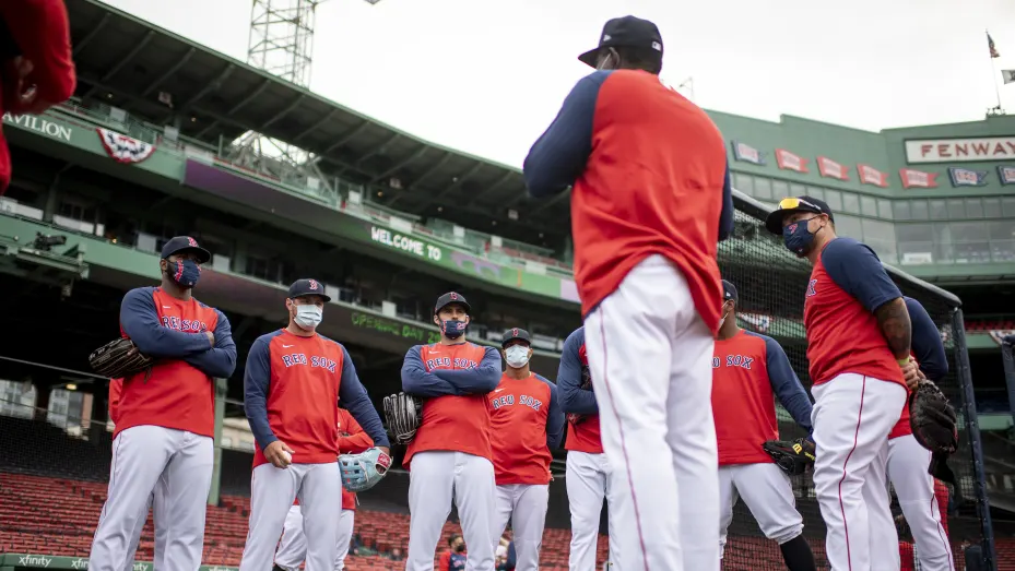 Members of the Boston Red Sox look on during a team workout ahead of the 2021 Opening Day game on March 31, 2021 at Fenway Park in Boston, Massachusetts.