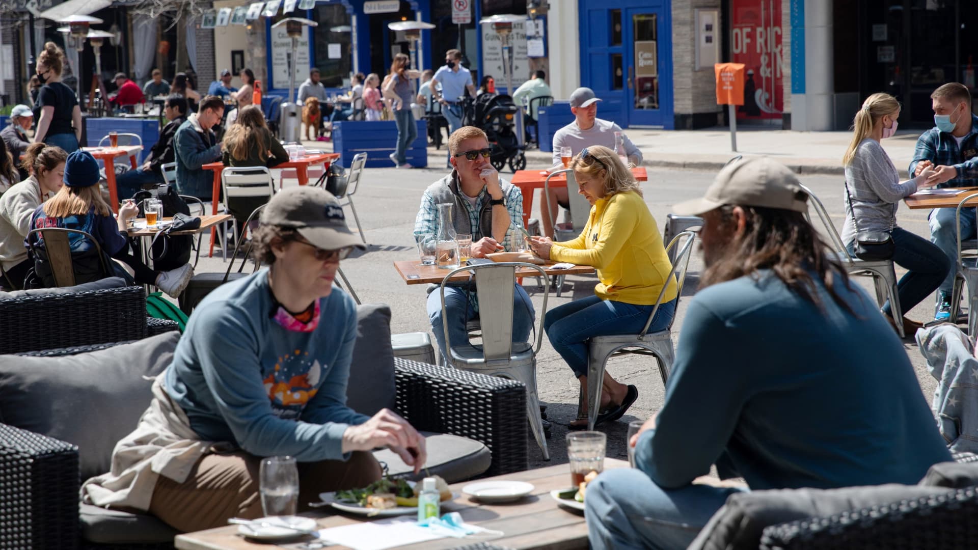 People crowd outdoor dining at a restaurant as coronavirus disease (COVID-19) restrictions are eased in Ann Arbor, Michigan, U.S., April 4, 2021.