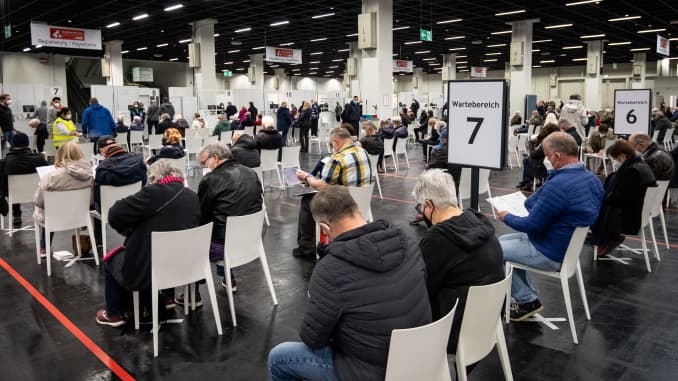 People wait in a vaccination center in Cologne, Germany on April 5, 2021.