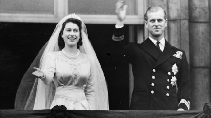 Princess Elizabeth and The Prince Philip, Duke of Edinburgh waving to a crowd from the balcony of Buckingham Palace, London shortly after their wedding at Westminster Abbey.