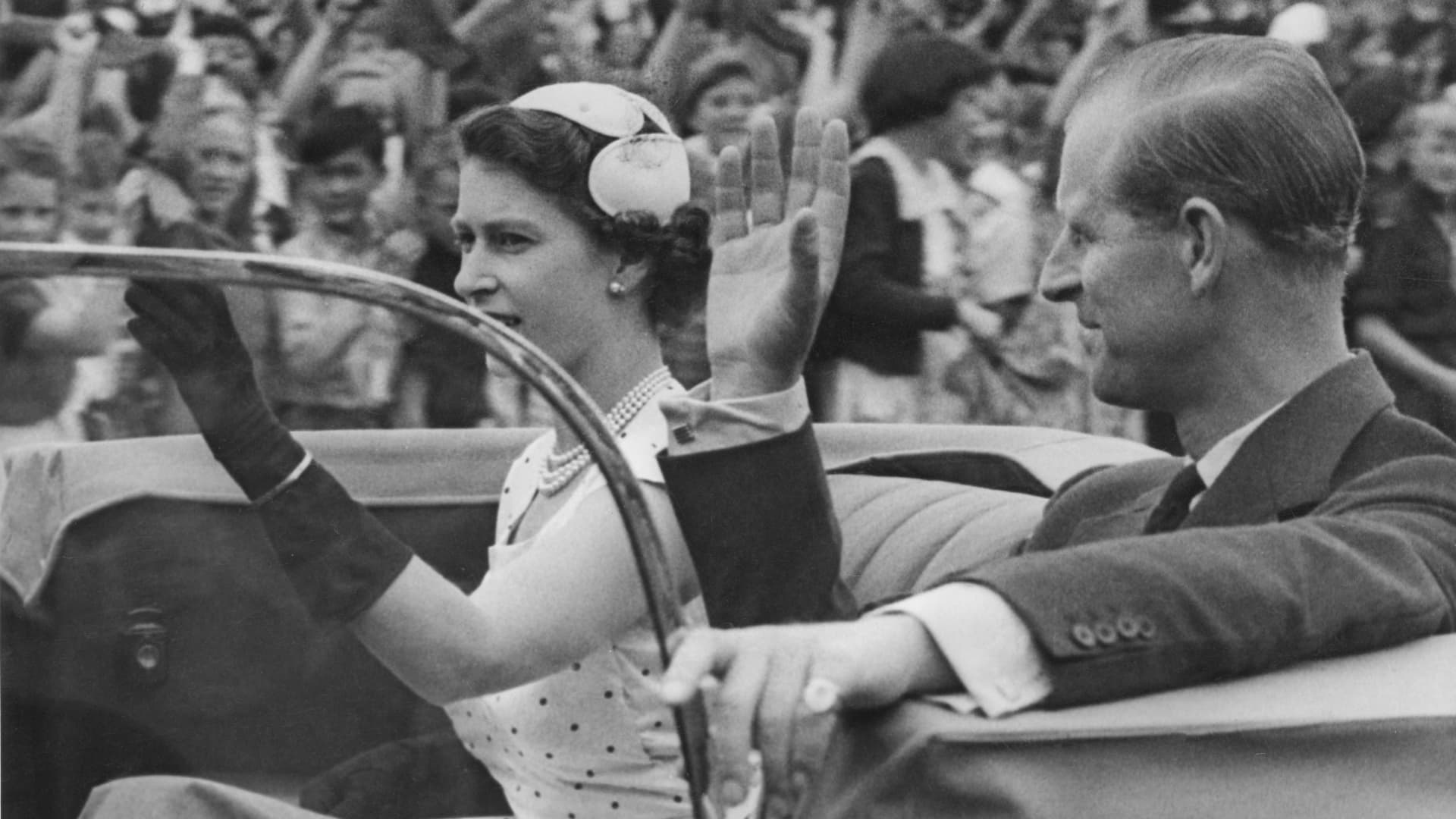 Queen Elizabeth II and Prince Philip returning to Government House after attending a youth rally in Auckland, New Zealand, during the coronation world tour, Dec. 24, 1953.