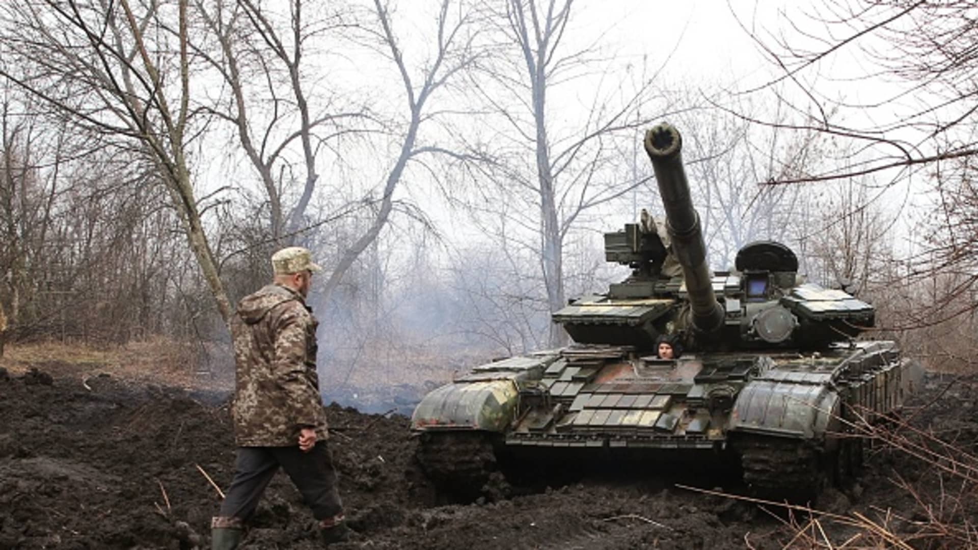Ukrainian servicemen work on their tank close to the front line with Russian-backed separatists near Lysychansk, Lugansk region on April 7, 2021.