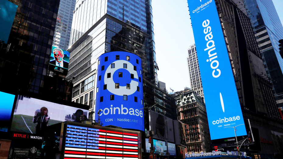 The logo for Coinbase Global Inc, the biggest U.S. cryptocurrency exchange, is displayed on the Nasdaq MarketSite jumbotron and others at Times Square in New York, U.S., April 14, 2021.