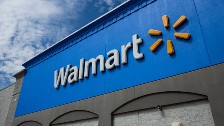 Walmart posts earnings beat, raises forecast
