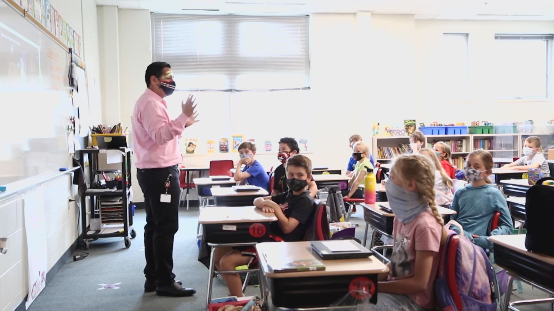 Lee Jimenez, a teacher at Indian Hill Elementary School in Cincinnati, Ohio, discusses credit cards and methods of payments with his 3rd grade class using online financial education curriculum SmartPath.