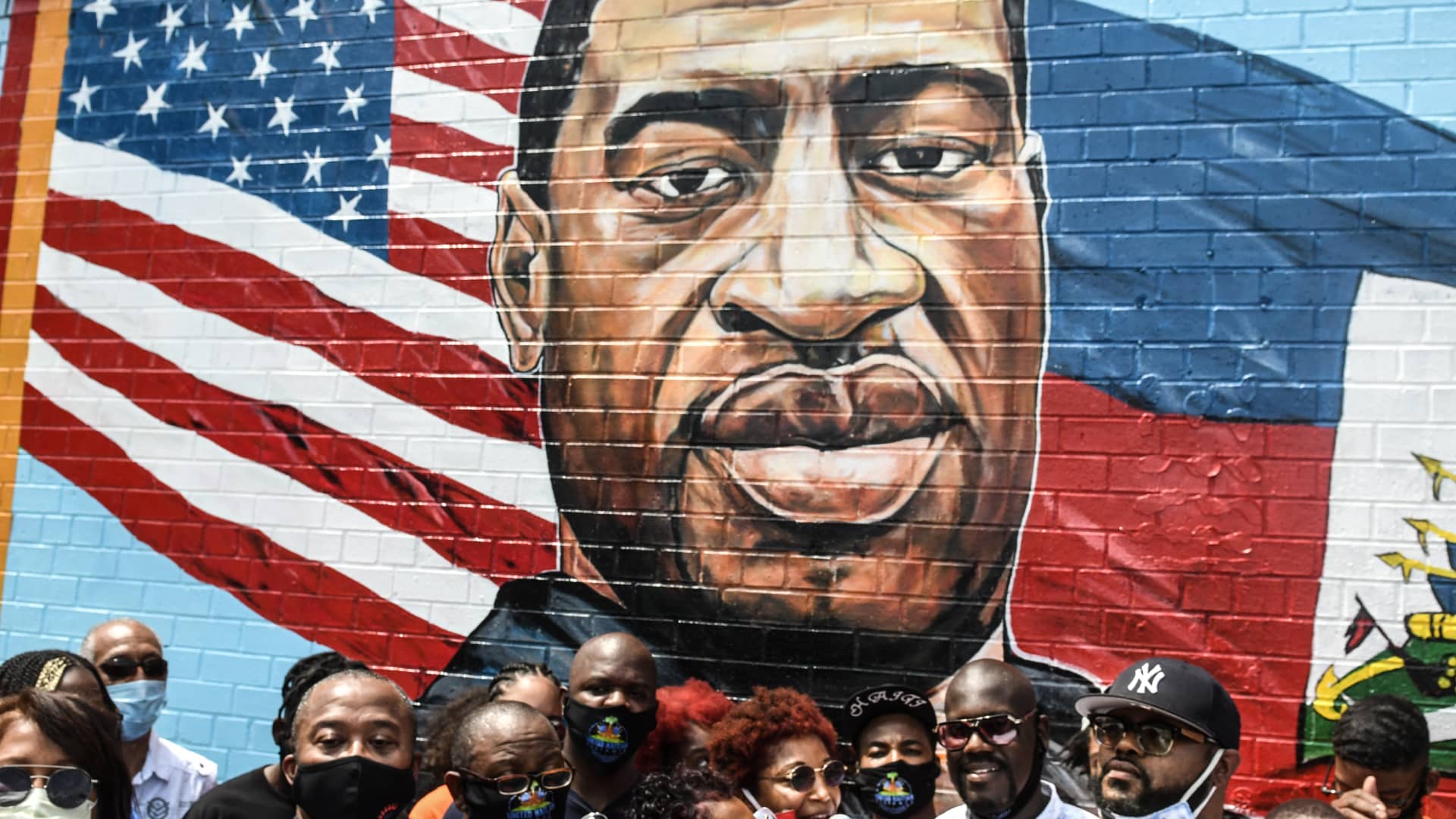Terrance Floyd (R), the brother of George Floyd, attends a unveiling of a mural painted by artist Kenny Altidor depicting George Floyd on a sidewall of CTown Supermarket on July 13, 2020 in Brooklyn, New York City.