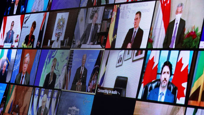 World leaders appear on screen during a virtual Climate Summit, seen from the East Room at the White House in Washington, U.S., April 22, 2021.