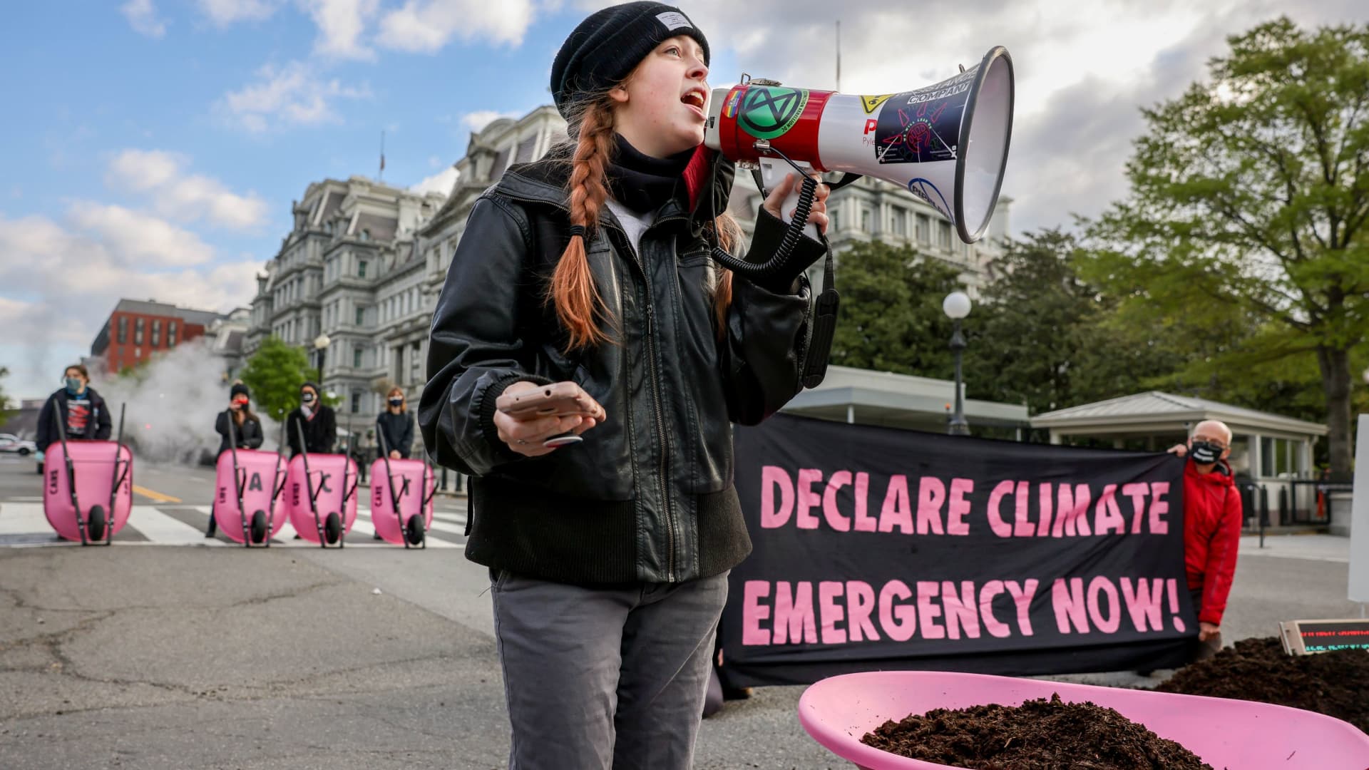 Extinction Rebellion DC blocks 17th Street after dumping cow manure outside the White House on Earth Day to protest President Biden's climate plan in Washington, April 22, 2021.