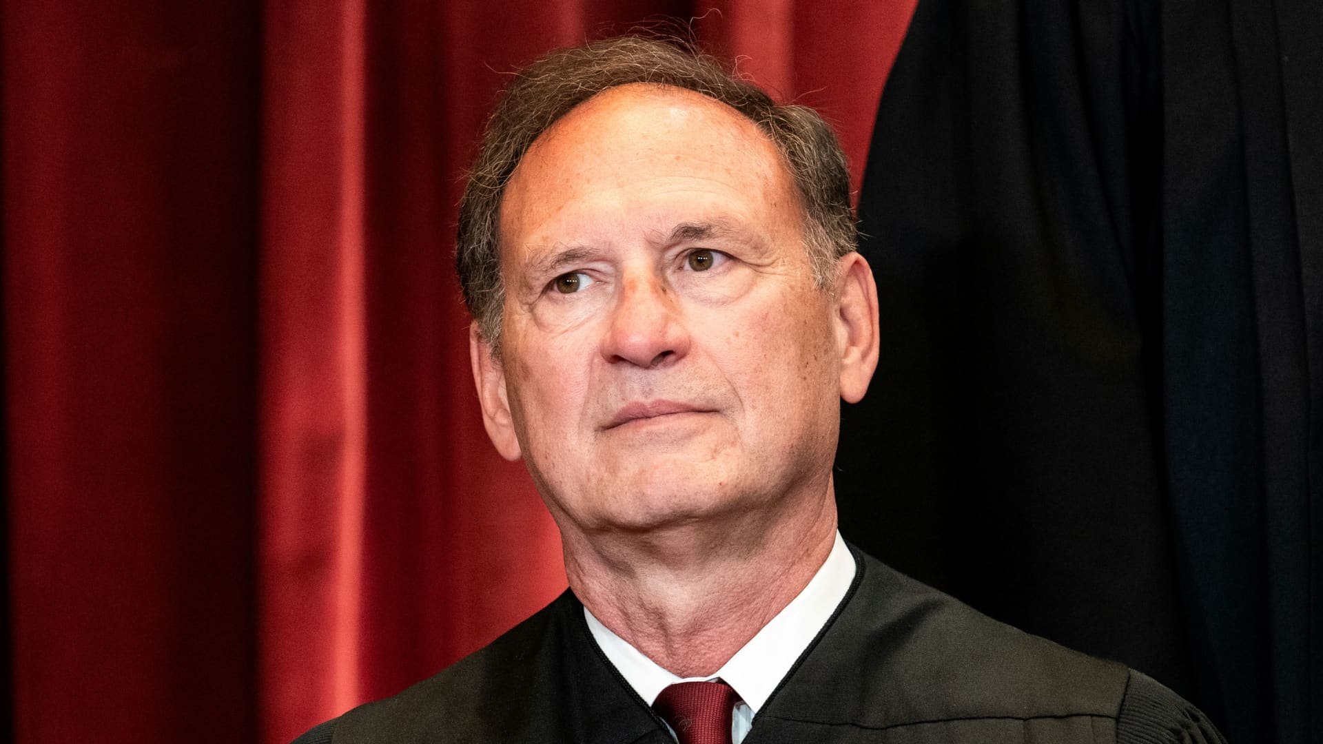 Associate Justice Samuel Alito poses during a group photo of the Justices at the Supreme Court in Washington, April 23, 2021.