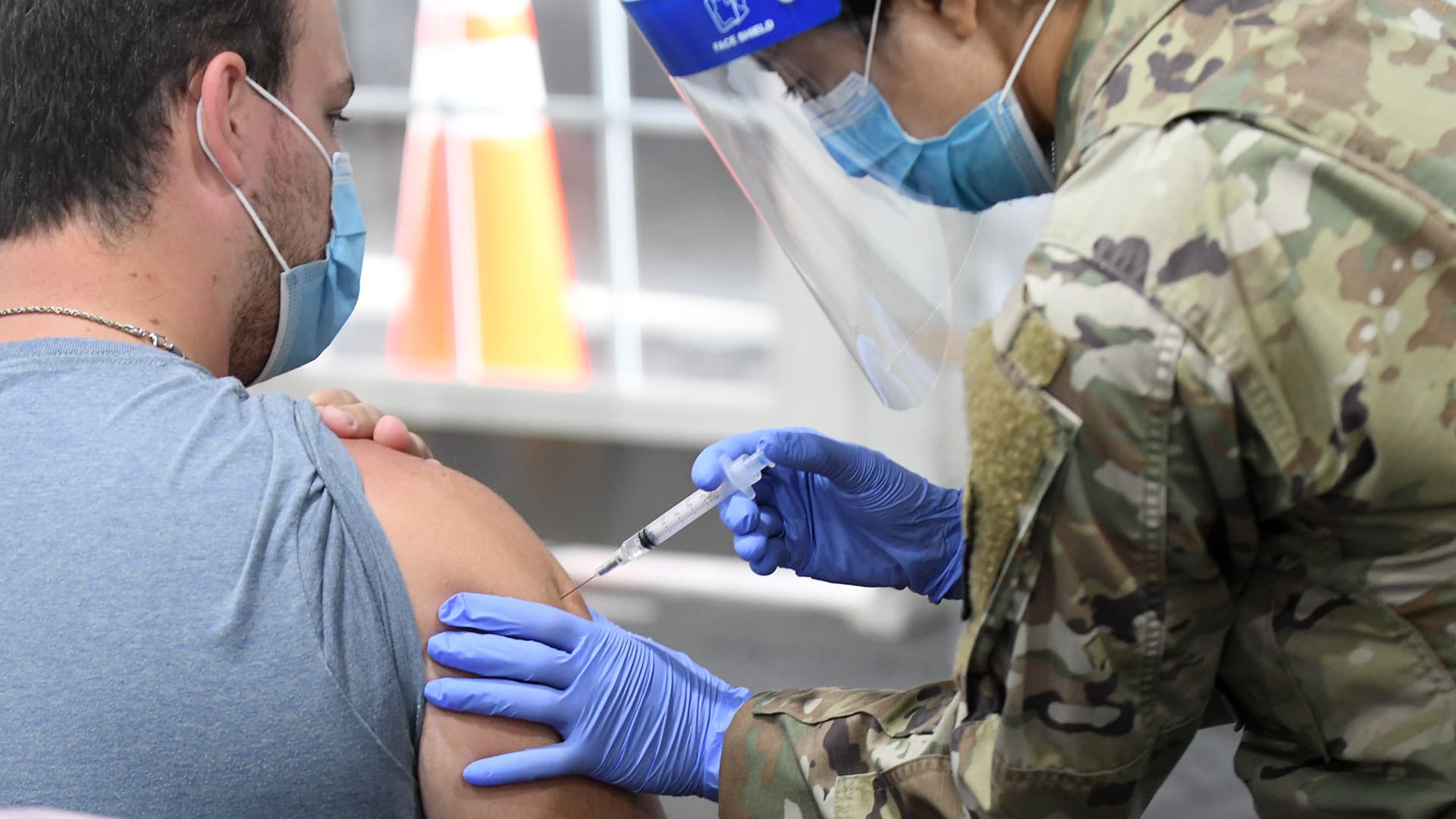 A man receives a shot at the FEMA-supported COVID-19 vaccination site at Valencia State College on the first day the site resumed offering the Johnson & Johnson vaccine following the lifting of the pause ordered by the FDA and the CDC due to blood clot concerns.