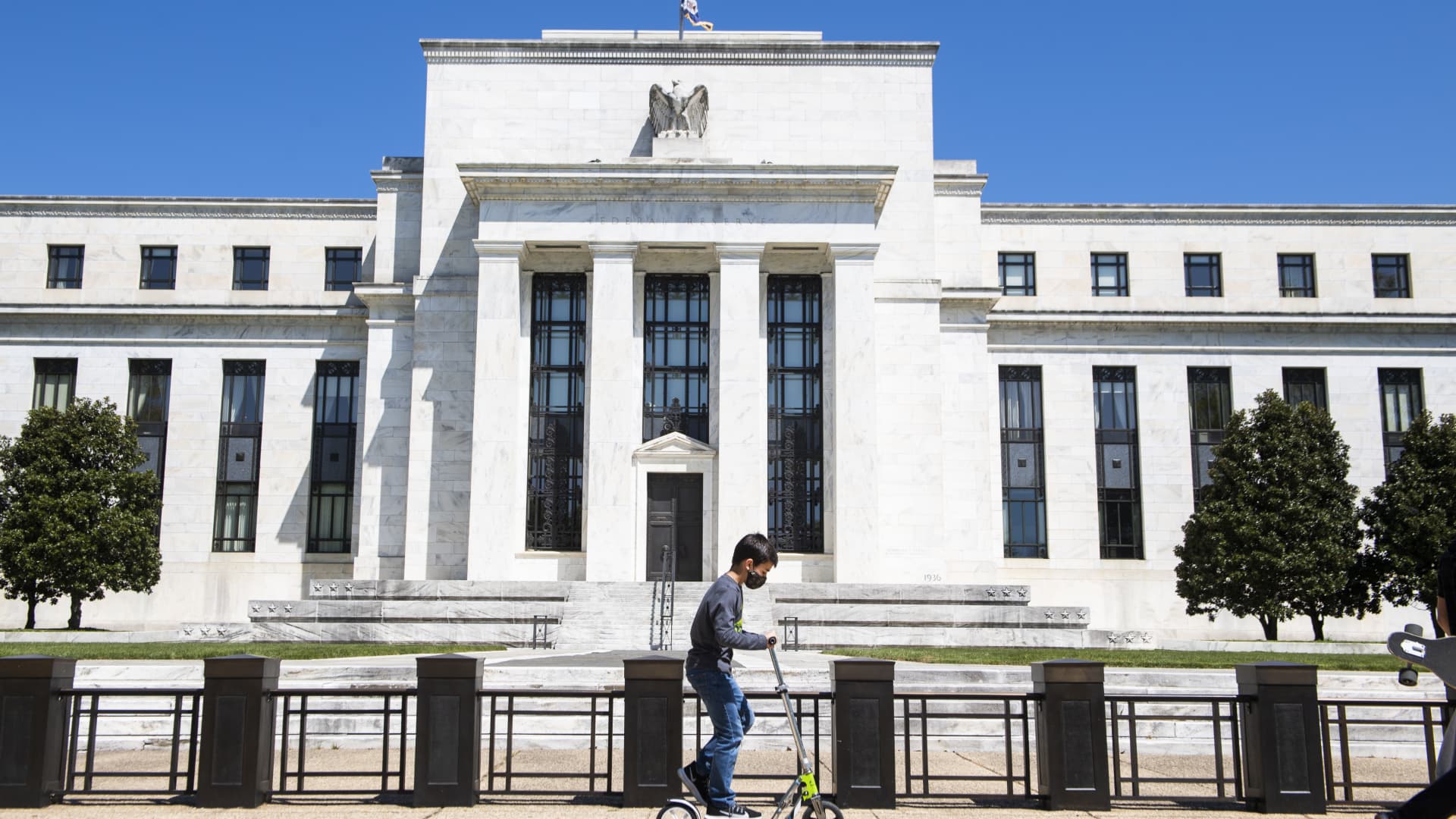 A child passes by the Marriner S. Eccles Federal Reserve Board Building on Constitution Avenue, NW, on Monday, April 26, 2021.