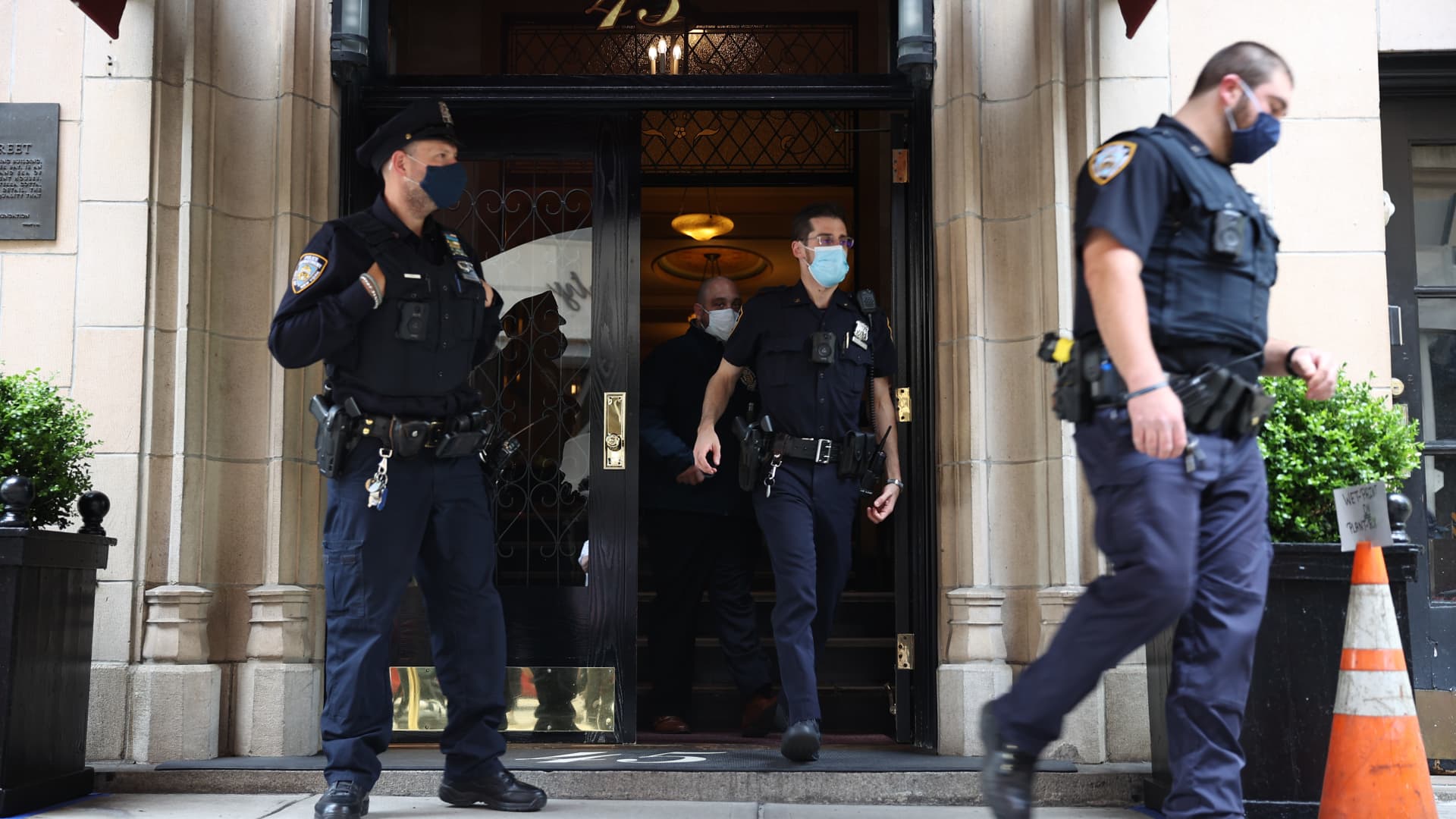 New York City Police officers investigate at the building where home of former President Donald Trump's personal attorney and the former mayor of New York City Rudy Giuliani located after FBI has executed a search warrant at Giulianiâs apartment in Manhattan of New York City, United States on April 28, 2021.