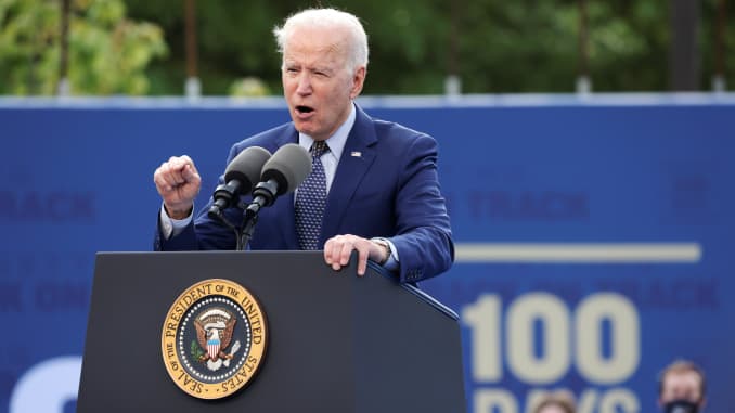 U.S. President Joe Biden gestures as he speaks during the Democratic National Committee's "Back on Track" drive-in car rally to celebrate the president's 100th day in office at the Infinite Energy Center in Duluth, Georgia, April 29, 2021.