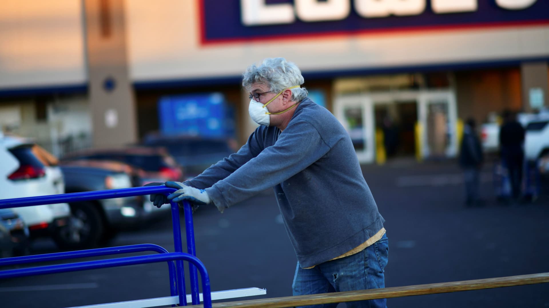 A shopper departs after visiting a Lowe's hardware store in Philadelphia, Pennsylvania, November 4, 2020.