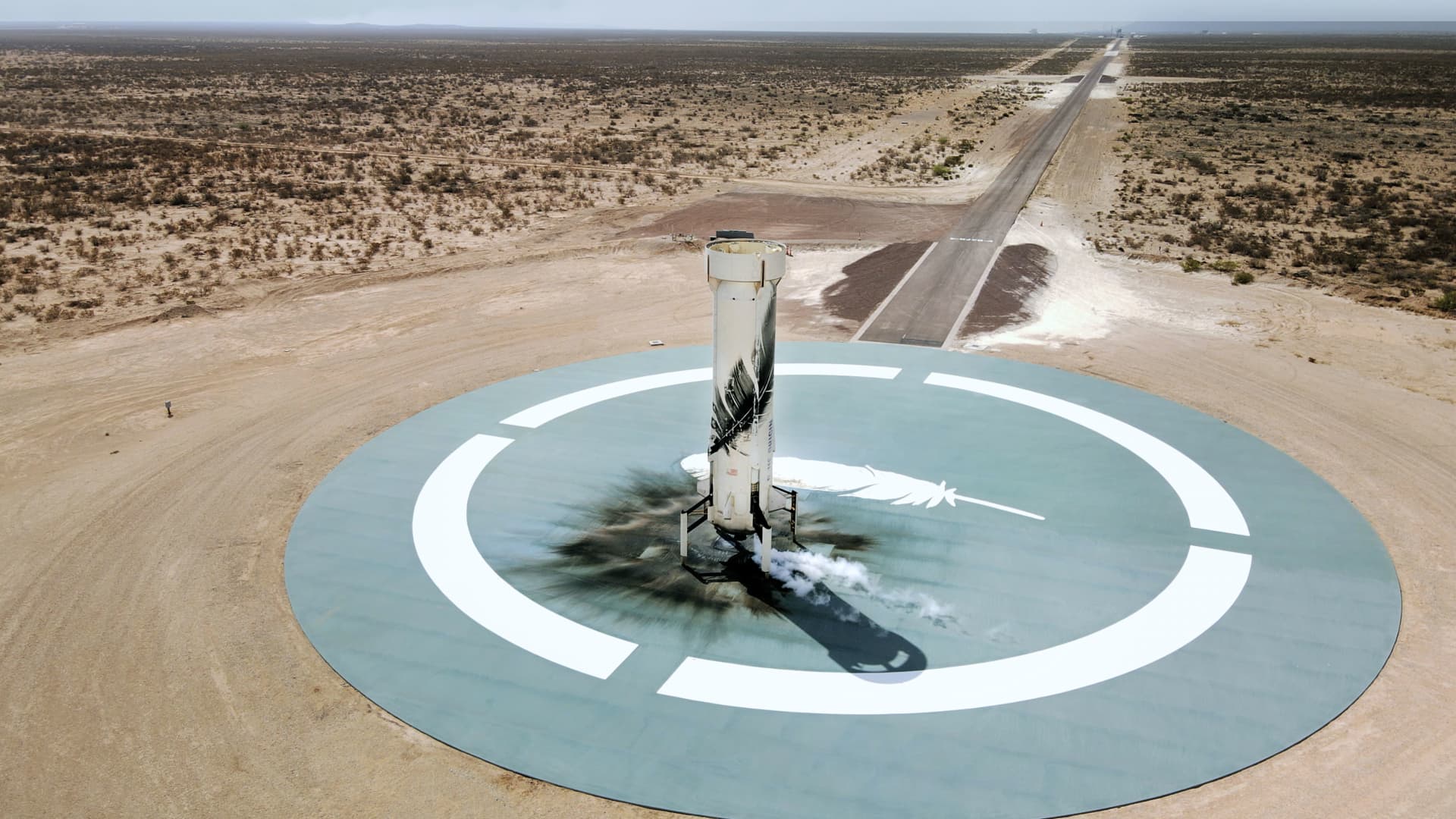 The New Shepard booster on the landing pad after NS-15's successful mission on April 14, 2021.