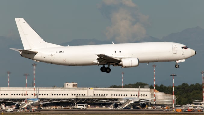 An ASL Airlines Boeing 737-400 freighter landing at Milan Malpensa airport.