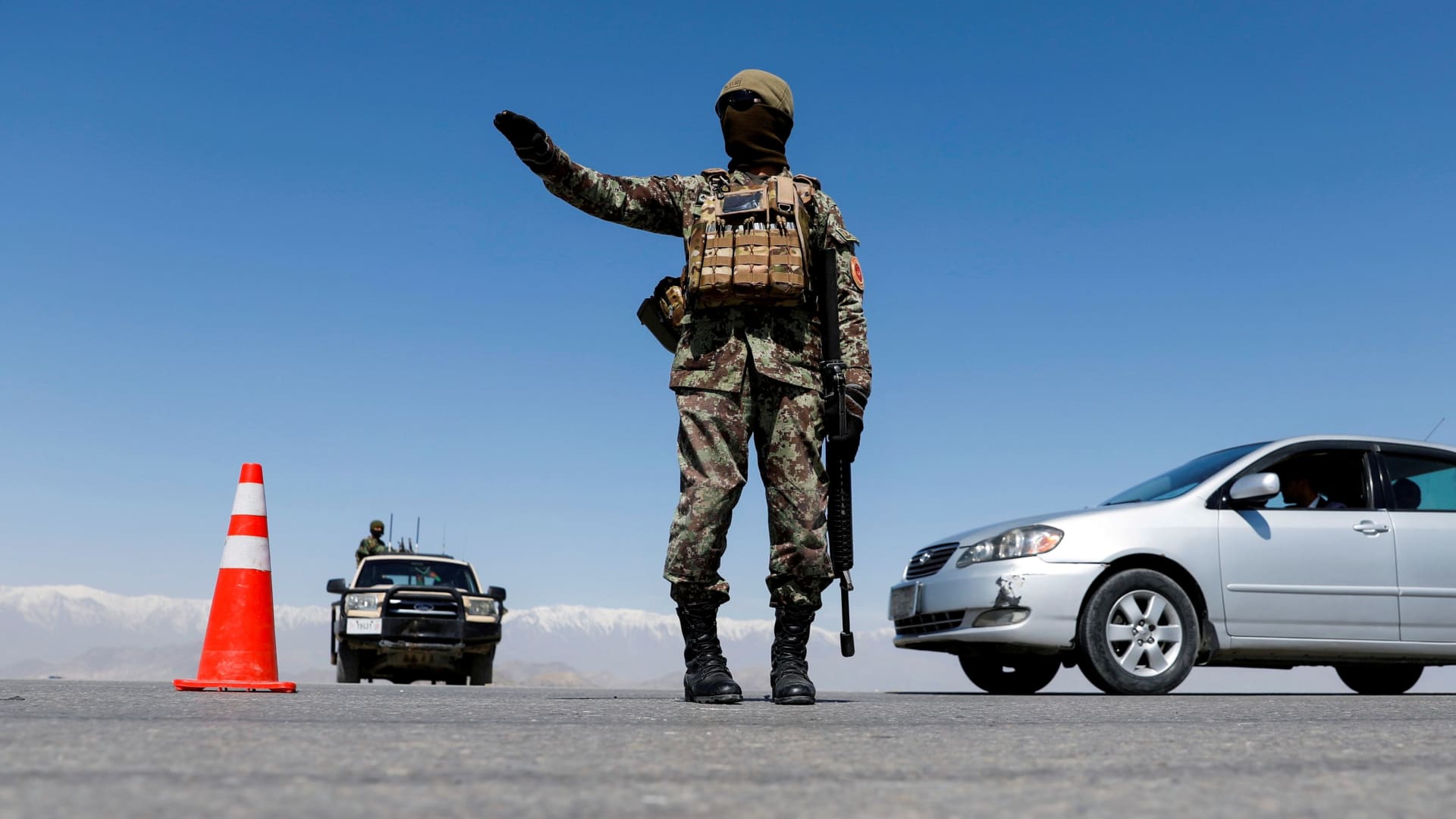 An Afghan National Army soldier stands guard at a checkpoint on the outskirts of Kabul, Afghanistan April 21, 2021.