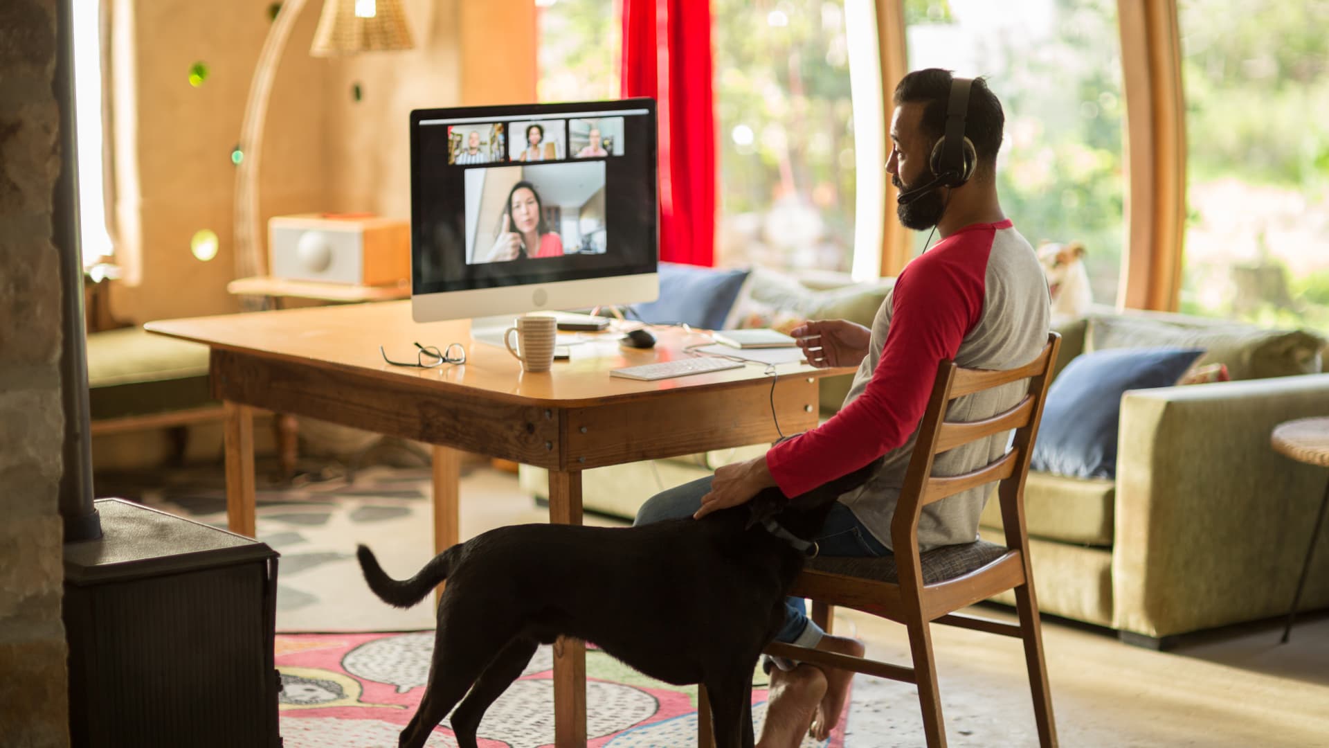 Use video chat to ask for an annual period of remote work to gauge your employer's body language, advises career coach Amanda Augustine.