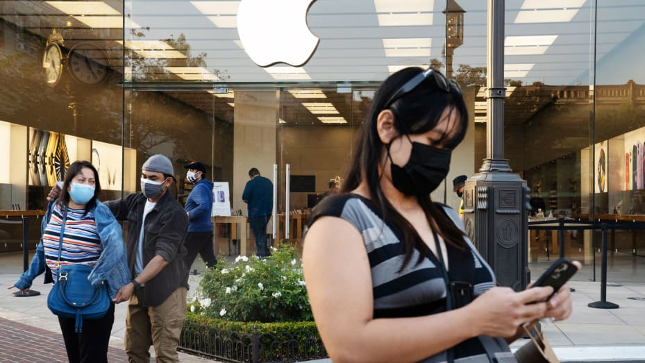 Shoppers wear protective masks outside an Apple Inc. store at the Americana at Brand shopping mall in Glendale, California, on Thursday, May 6, 2021.