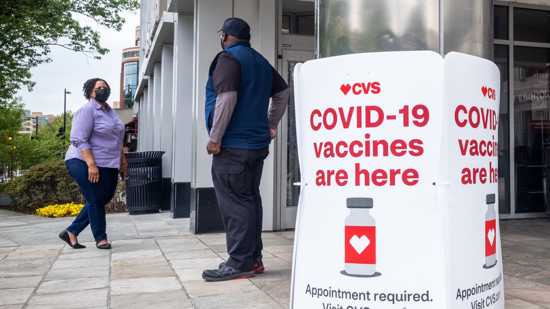 Signs offering COVID-19 vaccinations are seen outside of a CVS pharmacy in Washington, DC on May 7, 2021.
