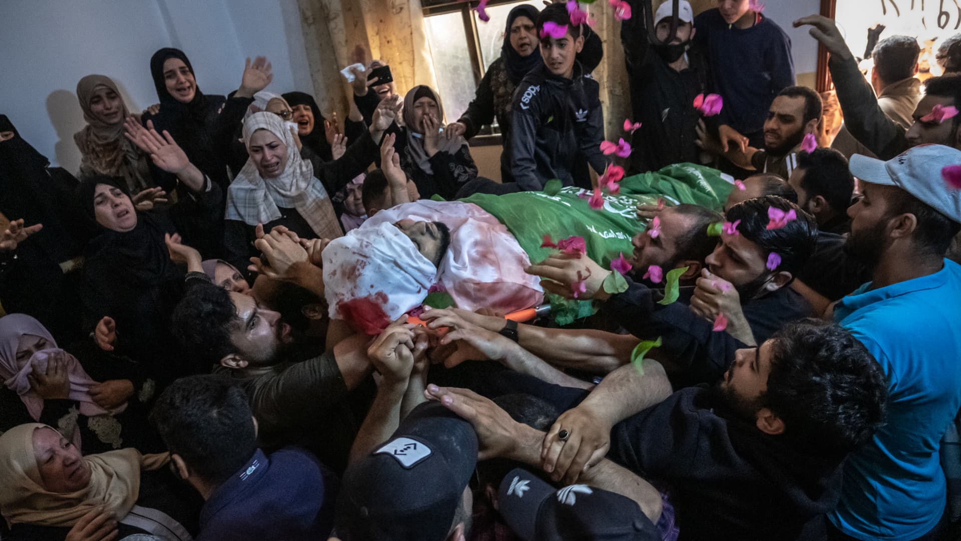 Relatives of Palestinian Ahmed Al-Shenbari, who was killed during an Israeli raid in Beit Hanoun city on the northern Gaza Strip, mourn during his funeral on May 11, 2021 in Gaza City, Gaza.