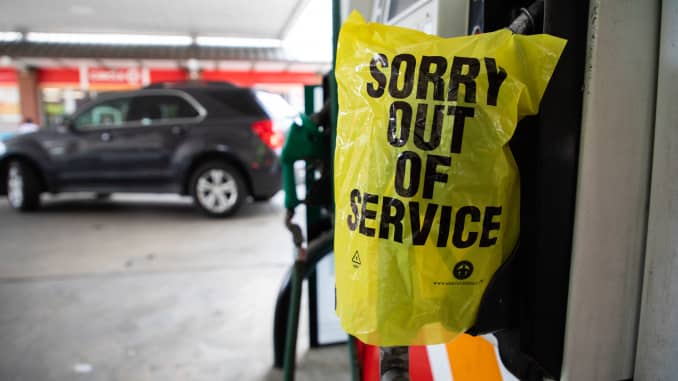An "Out Of Service" bag covers a gas pump as cars continue line up for the chance to fill their gas tanks at a Circle K near uptown Charlotte, North Carolina on May 11, 2021 following a ransomware attack that shut down the Colonial Pipeline.