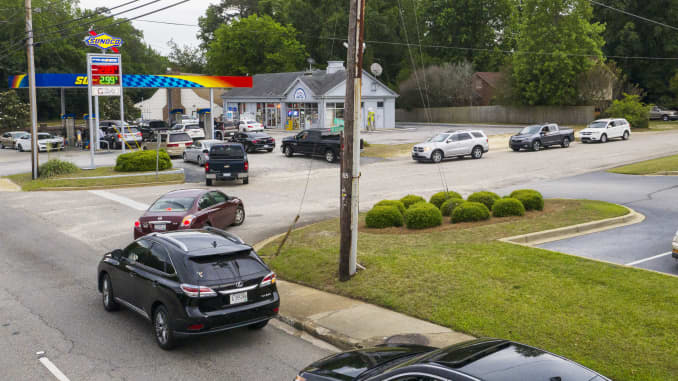 Vehicles line up to get fuel at a Sunoco gas station in Sumter, South Carolina, U.S., on Tuesday, May 11, 2021.