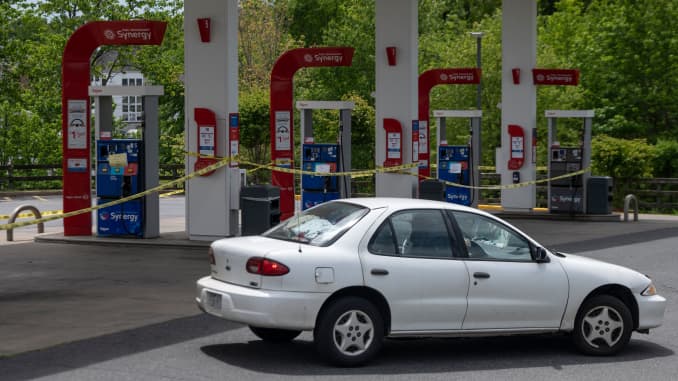 A motorist looking for gas drives past closed pumps at an Exxon gas station in Woodbridge, Virginia, on May 12, 2021.