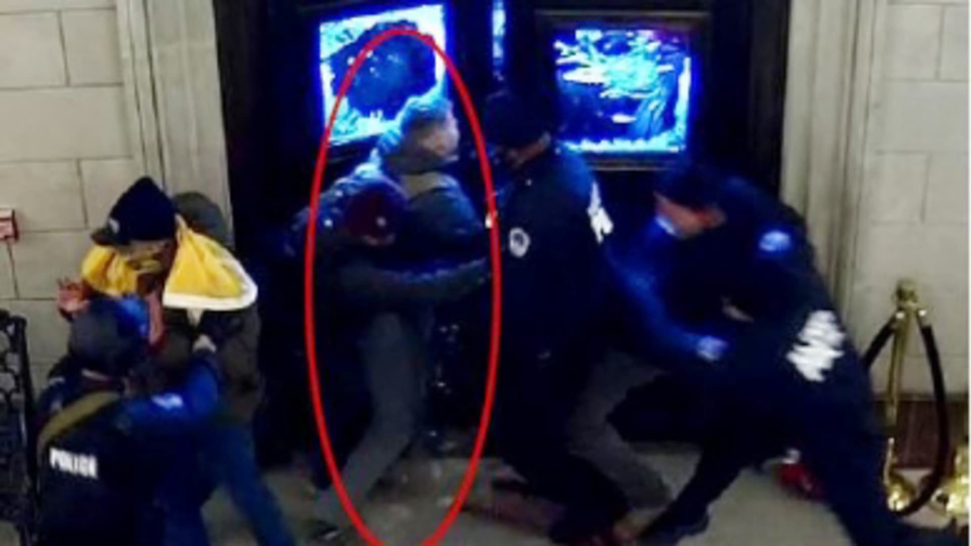A still from a video released by the D.O.J. showing Christopher Warnagiris (circled in red), who is a Marine Corps commissioned officer stationed at the Marine Corps Base Quantico was arrested today in Virginia and charged with crimes related to the breach of the U.S. Capitol on Jan. 6.
