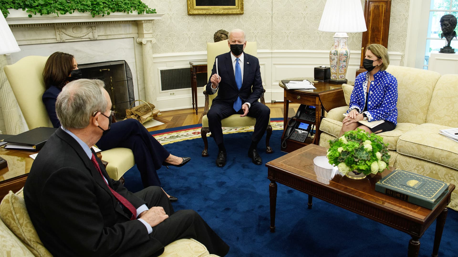 President Joe Biden(C) and Vice President Kamala Harris(L) meet with Republican Senator from West Virginia Shelley Moore Capito (R) and Republican Senator Mike Crapo of Idaho (frontL) to discuss an infrastructure bill in the Oval Office at the White House in Washington, DC, on May 13, 2021.