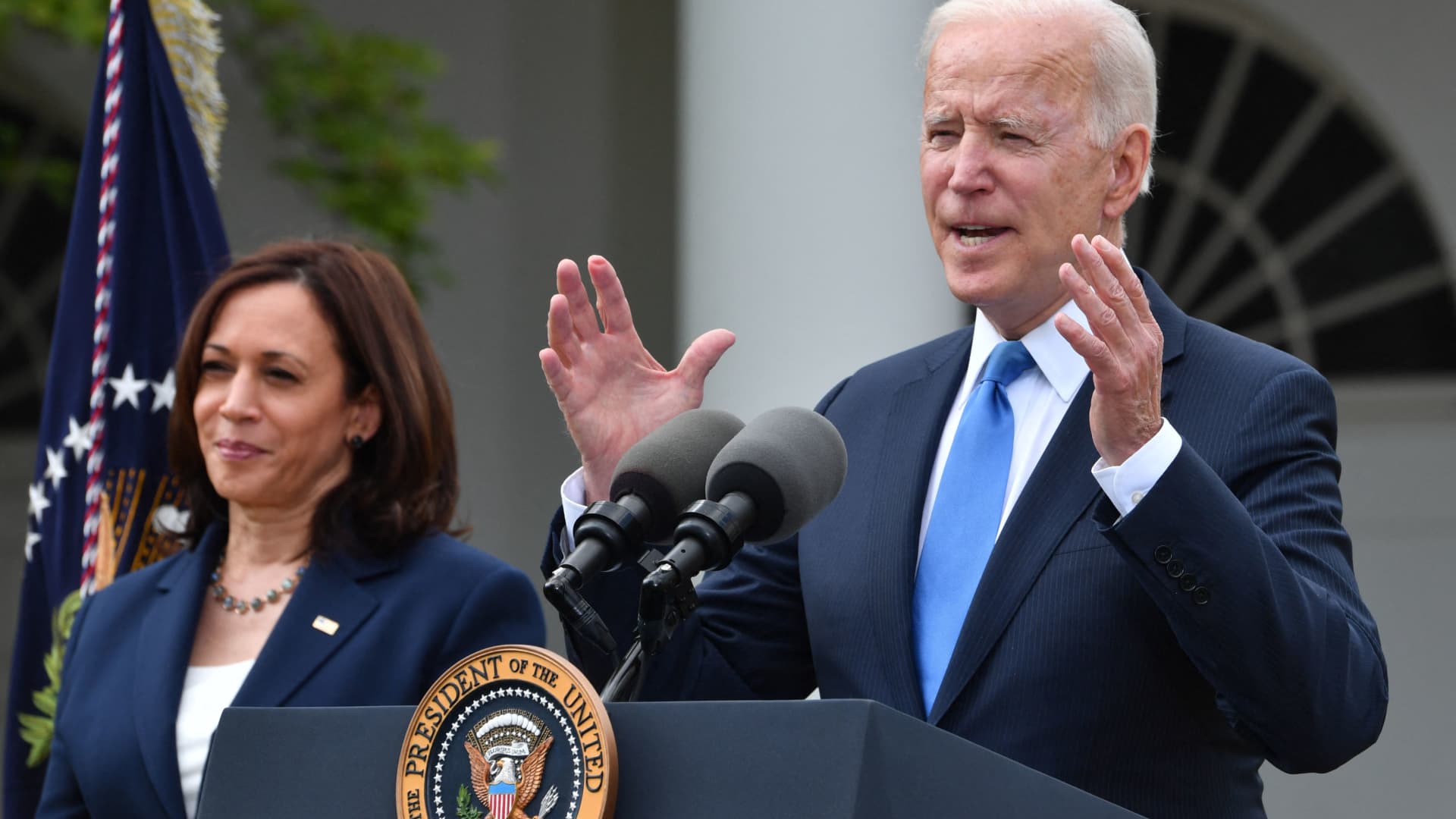 US Vice President Kamala Harris looks on as US President Joe Biden delivers remarks on Covid-19 response and the vaccination program, from the Rose Garden of the White House, Washington, DC on May 13, 2021.