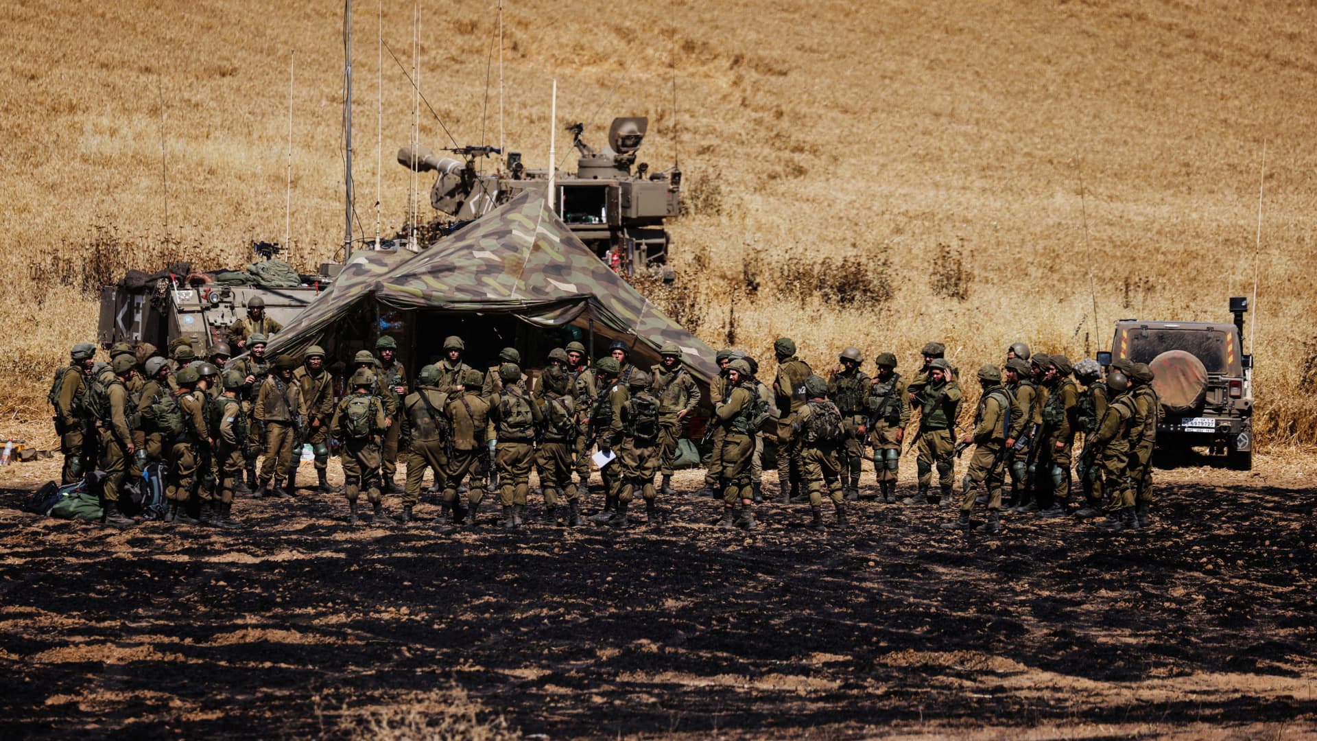 Israeli soldiers of an artillery unit gather near the border between Israel and the Gaza Strip, on its Israeli side May 14, 2021.