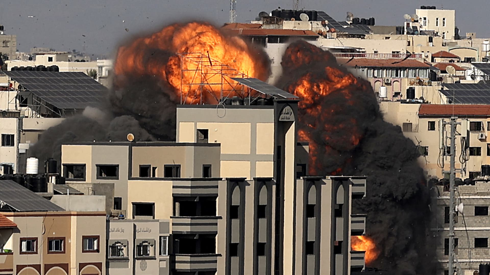 A picture shows the explosion after an Israeli strike targeted a building in Gaza City on May 14, 2021.