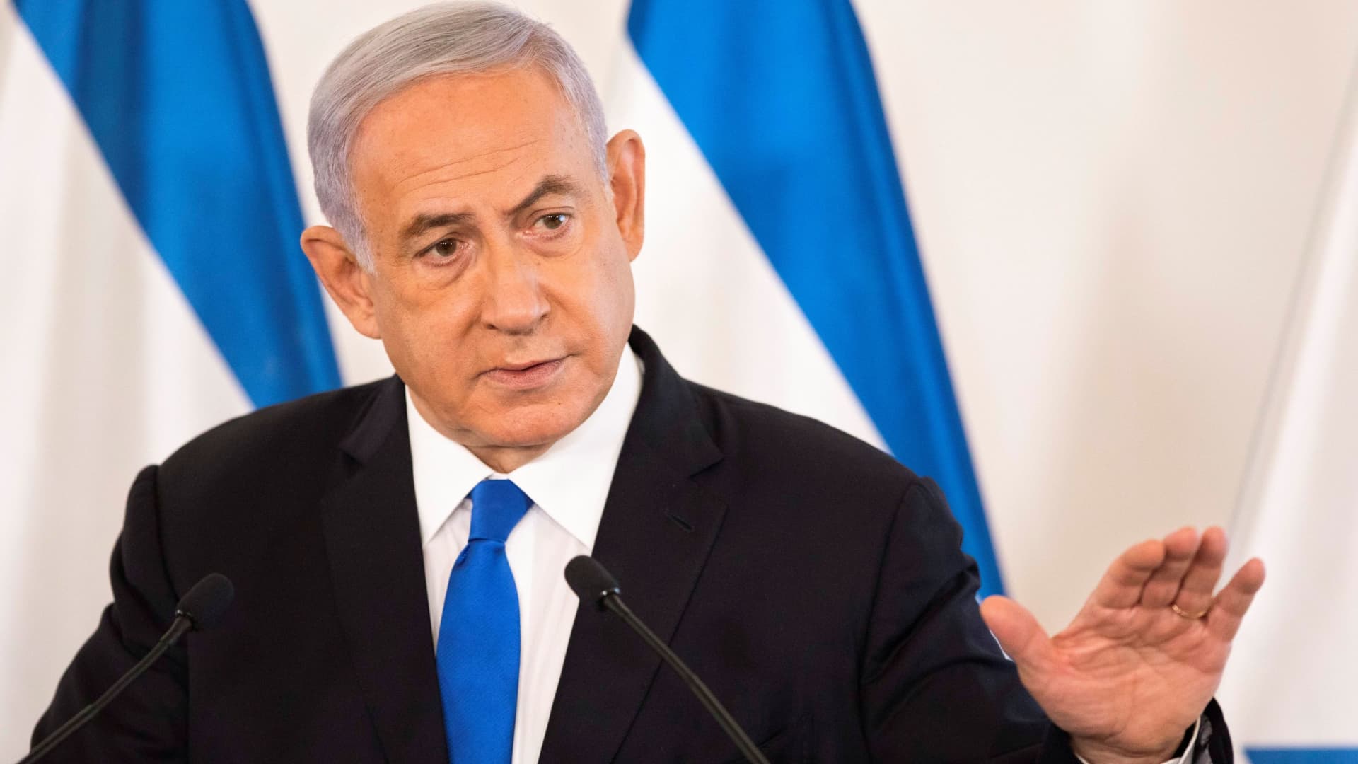 Israeli Prime Minister Benjamin Netanyahu gestures as he speaks during a briefing to ambassadors to Israel at a military base in Tel Aviv, Israel May 19, 2021.