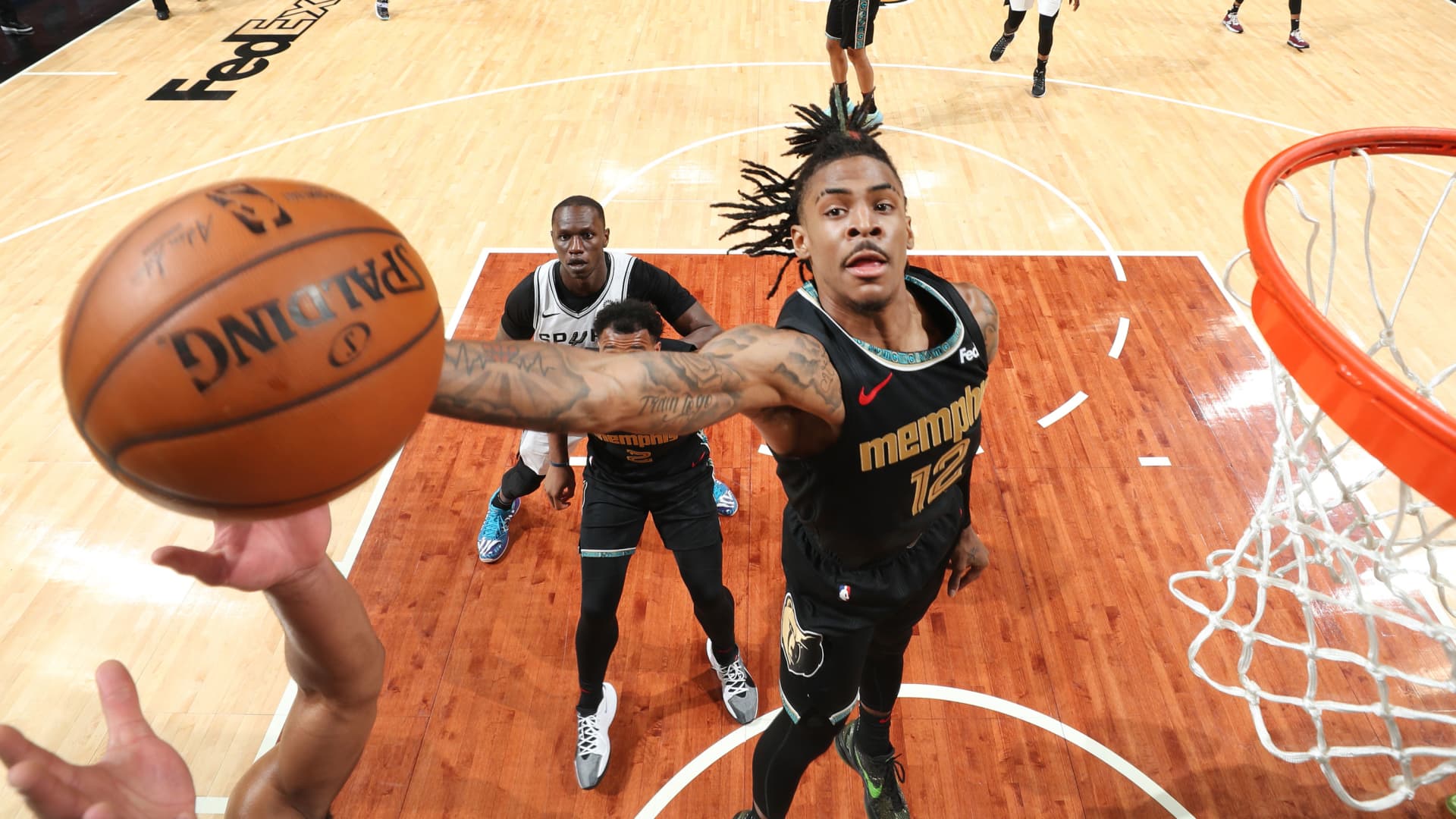 Ja Morant #12 of the Memphis Grizzlies rebounds the ball against the San Antonio Spurs during the 2021 NBA Play-In Tournament on May 19, 2021 at FedExForum in Memphis, Tennessee.