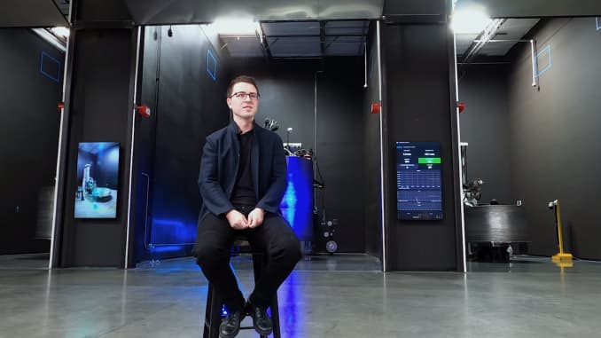 CEO Tim Ellis sits in front of the 3D-printer bays in the company's Long Beach, California factory.