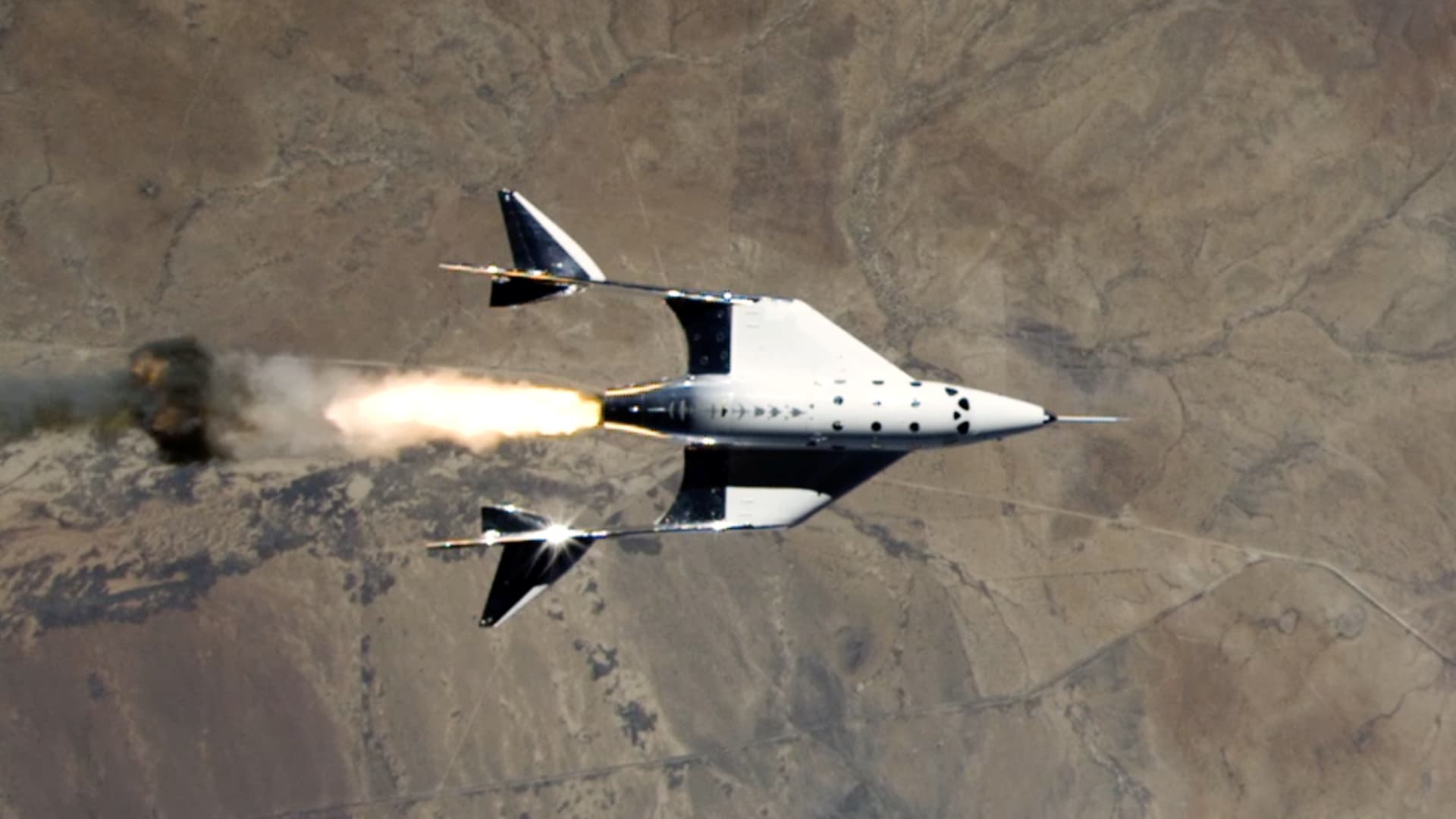 VSS Unity fires its rocket engine shortly after launching on its third spaceflight on May 22, 2021.