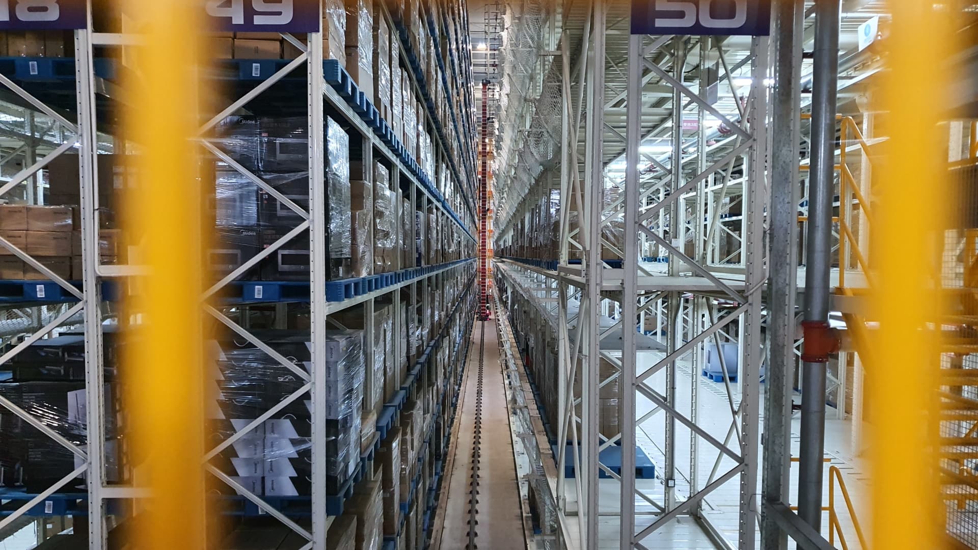An automated machine stacks packages at Chinese e-commerce giant JD.com's huge logistics center in Dongguan, China.