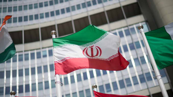 The flag of Iran is seen in front of the building of the International Atomic Energy Agency (IAEA) Headquarters ahead of a press conference by Rafael Grossi, Director General of the IAEA, about the agency's monitoring of Iran's nuclear energy program on May 24, 2021 in Vienna, Austria.