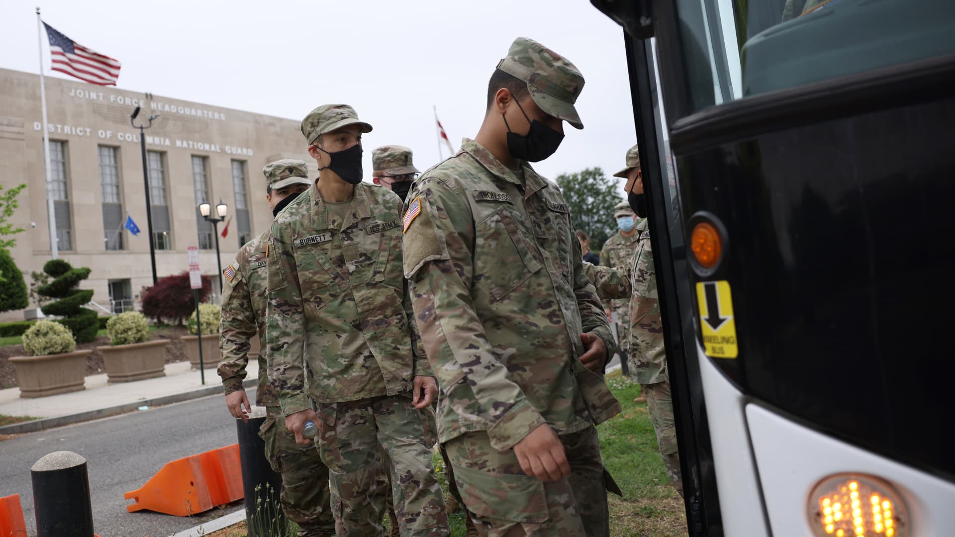 National Guard troops board buses as they leave the Armory after ending their mission of providing security to the U.S. Capitol on May 24, 2021 in Washington, DC.