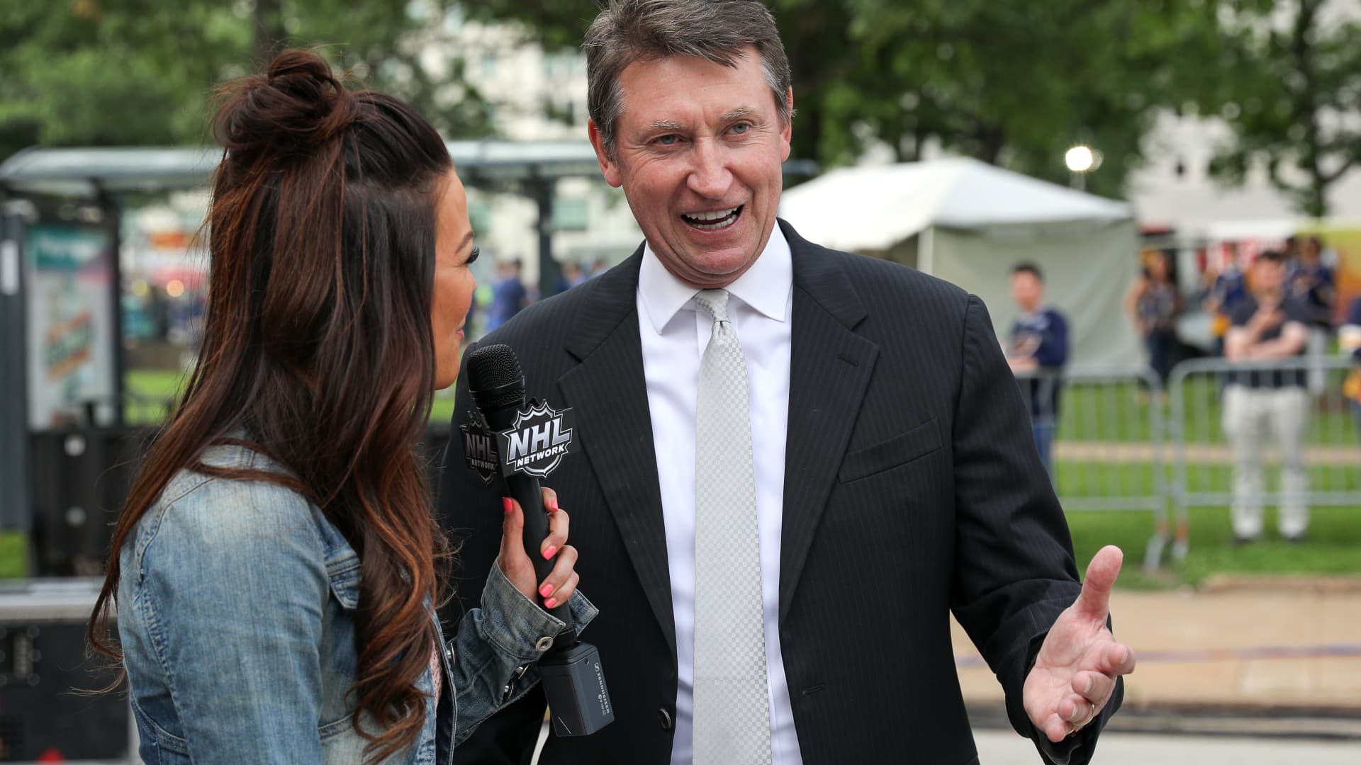 Jamie Redmond interviews Wayne Gretzky before Game Four of the 2019 NHL Stanley Cup Final between the Boston Bruins and the St. Louis Blues at Enterprise Center on June 03, 2019 in St Louis, Missouri.