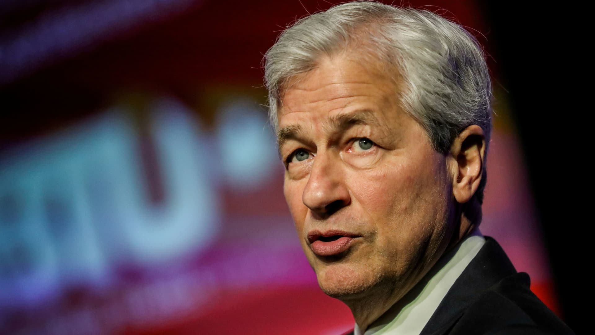 JPMorgan Chase says second-quarter profit fell 28% after building reserves for b..